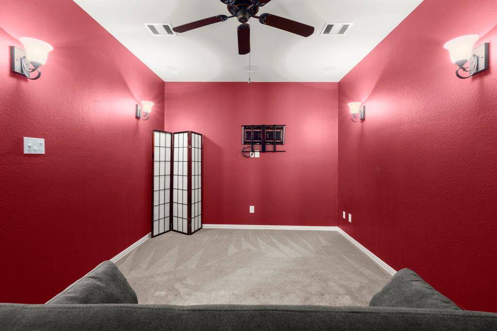 Media room pre-wired surround sound with receiver included for cinematic enjoyment. Can also serve as a 5th bedroom, guest suite, or private retreat. Plush carpeting, dimmable lighting, and built-in features create the perfect ambiance.