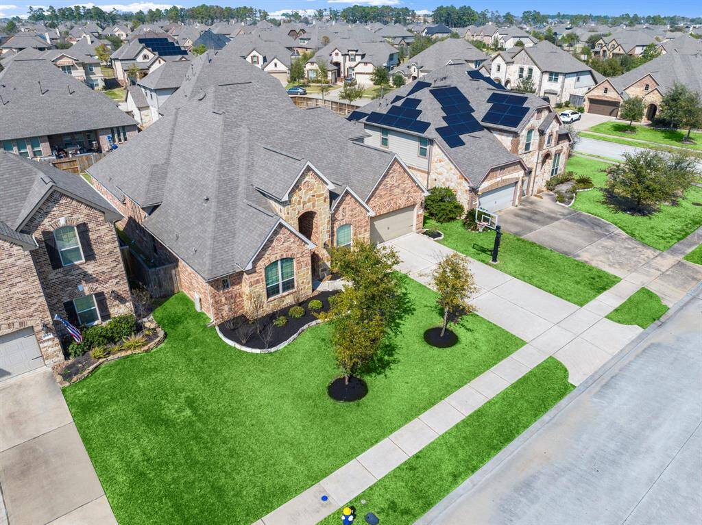 A sprinkler system keeps landscaping lush and green year-round.