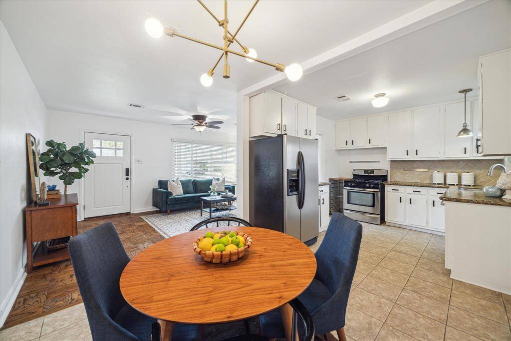 A view from the dining area makes it easy to keep an eye on everything that's happening in the living room & Kitchen. The house is open and bright, and you can see almost everything from each room. It's perfect for families and gatherings.