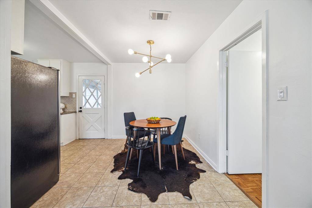 Right off the kitchen and dining area is the primary bedroom which is separate from the other 2 bedrooms.