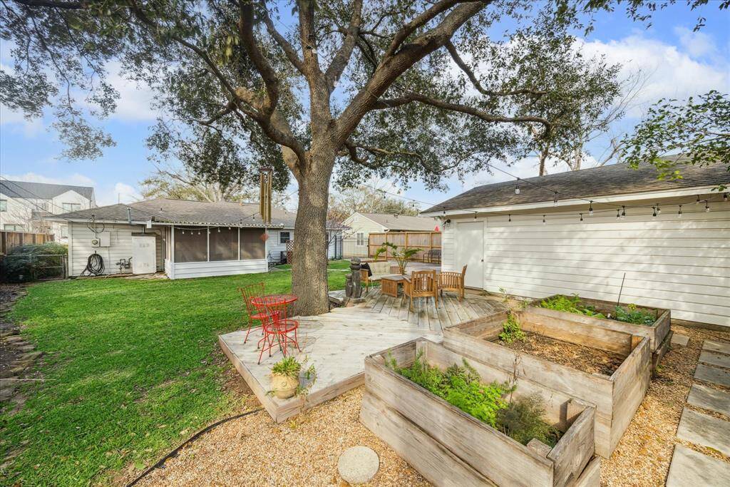 The sellers built the deck to enjoy all the joys nature has to offer. Relax under the Oak tree and string lights while admiring your lush and zen garden.