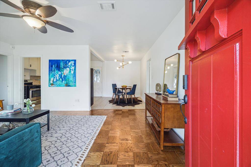Upon entry, you can see the uninterrupted flow from the living room to the kitchen and dining areas. To the left is a hallway that leads to the 2 secondary bedrooms and shared bathroom. To the right, is the primary bedroom and bathroom. The open concept gives you a clear view of the heart of the home as soon as you walk in the door.