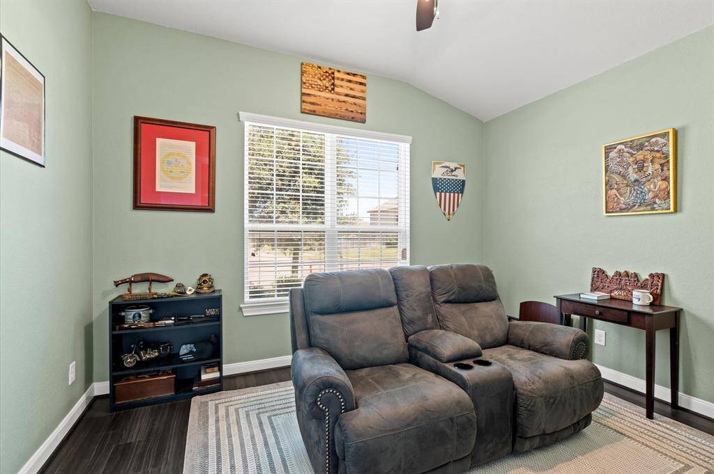 At the front of the home, this delightful study rests behind double doors. Here you'll see how easy it is to utilize the space as a media room. It could also serve as a play room, a craft room, or even a 5th bedroom.