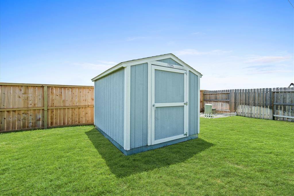 A handy storage shed conveys with the home.