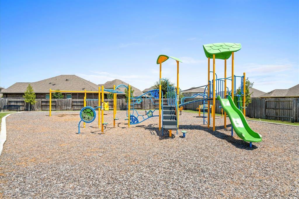 Take a walk to this charming playground with plenty of room for running and playing.