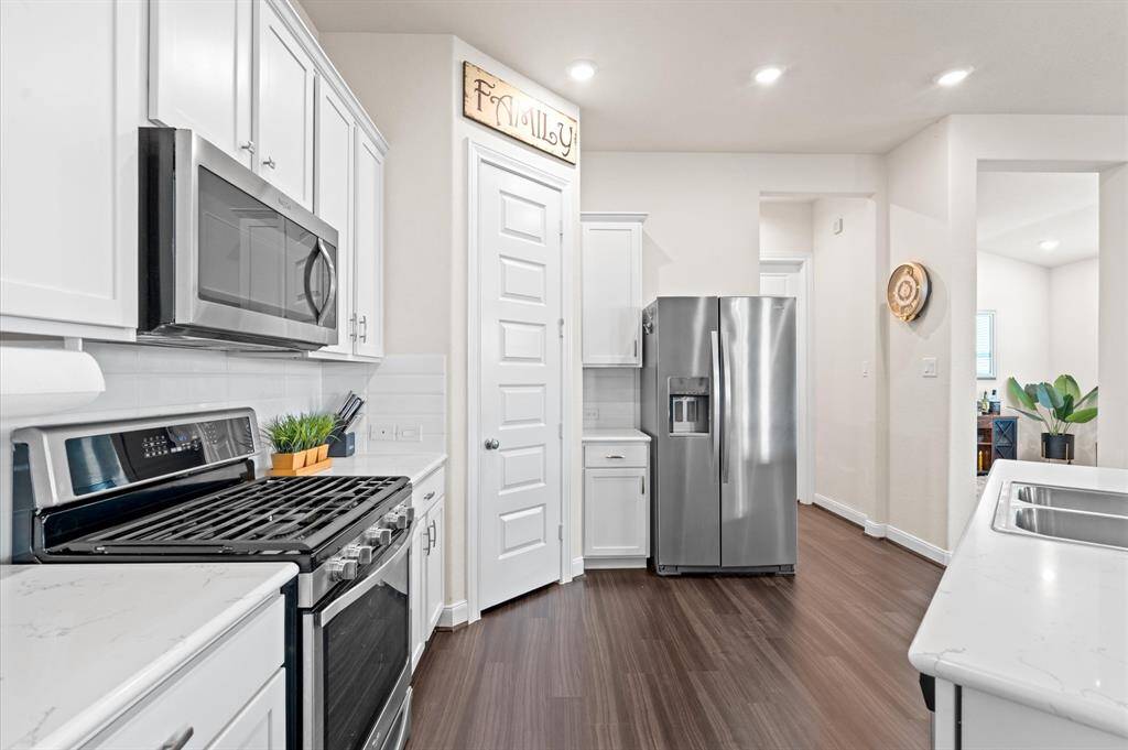 You'll love the counter space and cabinets in this island kitchen. The refrigerator conveys with the home.
