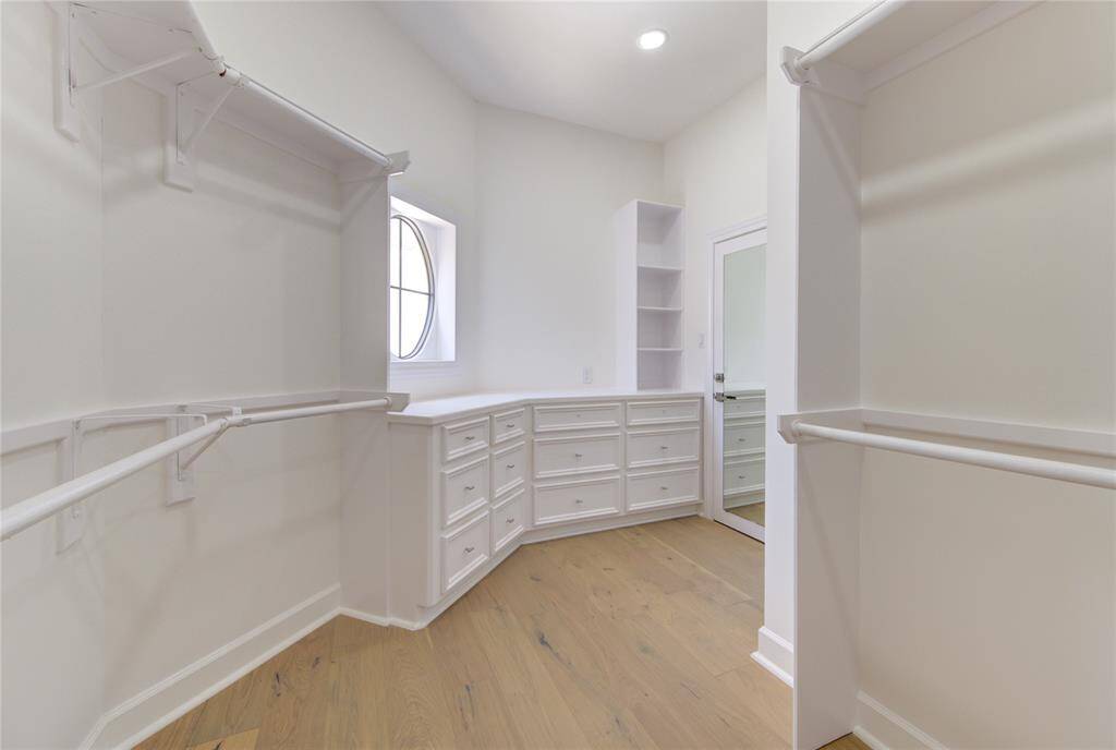 "Hers" Closet w/ plentiful storage