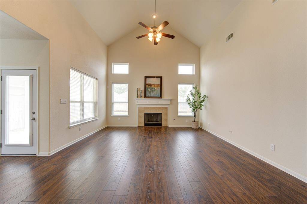 Welcome to the heart of the home, where comfort meets luxury. This family room boasts high ceilings, multiple windows, allowing natural light to flow through the space.