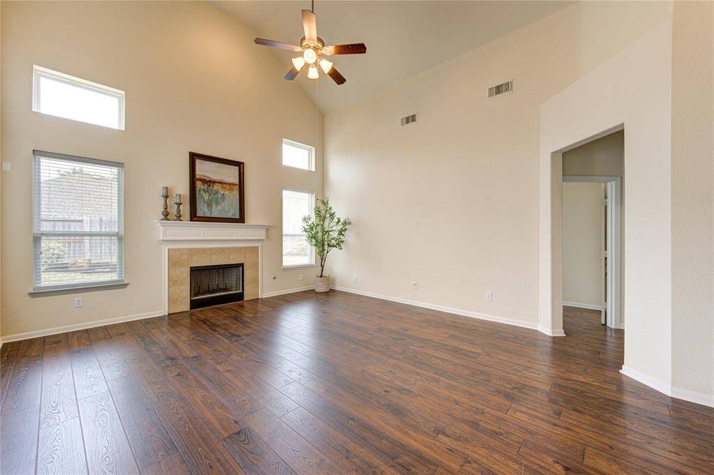 Casual elegance comes naturally in a room like this. Entertain in grand style in the living room graced by a cozy fireplace.