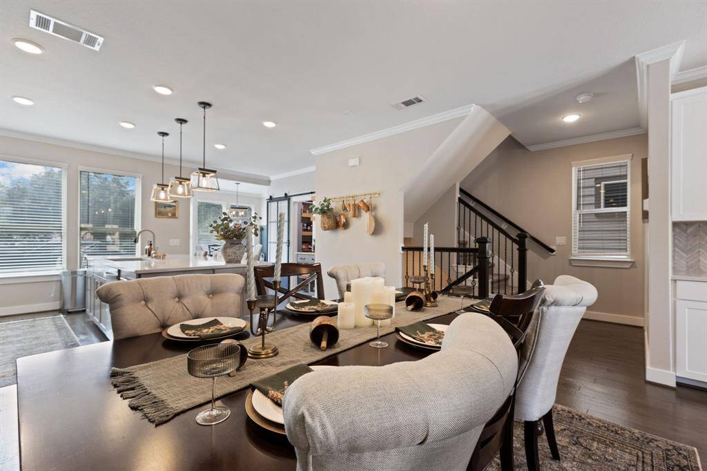 View from dining area to kitchen.  Home is light and bright with tons of natural light . High ceilings throughtout.