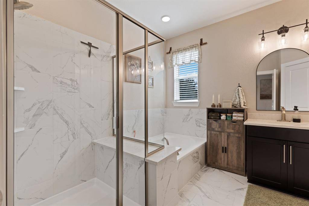 Primary bath with huge walk in shower and nice big saoking tub!