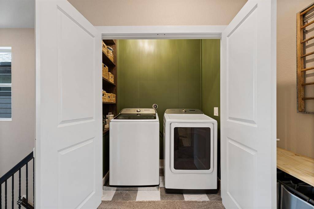 Laundry room conveniently located on 3rd floor with primary and 2 secondary bedrooms.  Has custom cabinetry.  Tankless water heater installed 2024 located in attic.