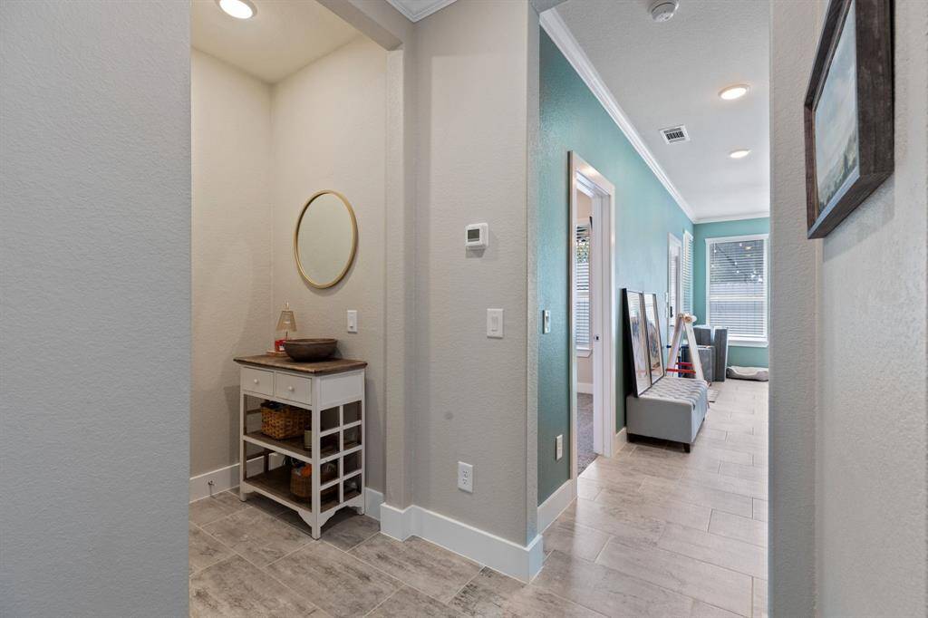 Let's check out the first floor !!! Huge 2nd living area or game room with full bed & bathrrom has it's own covered patio and yard!