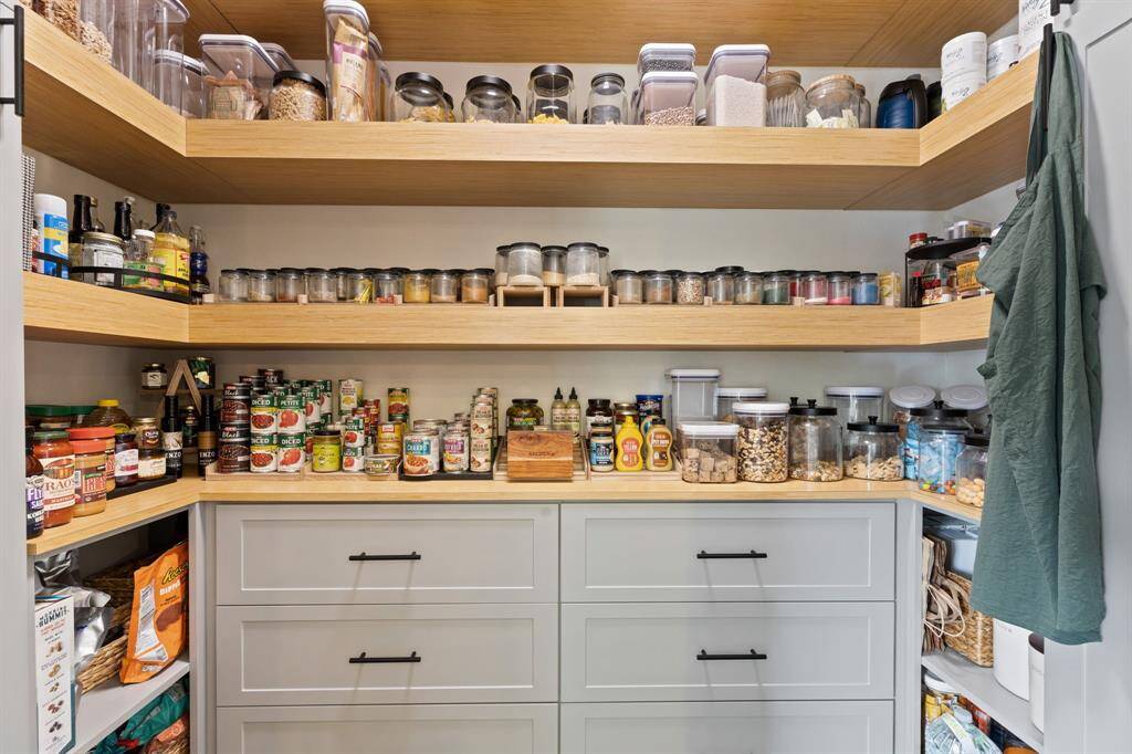 Custom designed walk in pantry with tons of storage, electrical outlets and draws.    Microwave has it's own little cubby.
