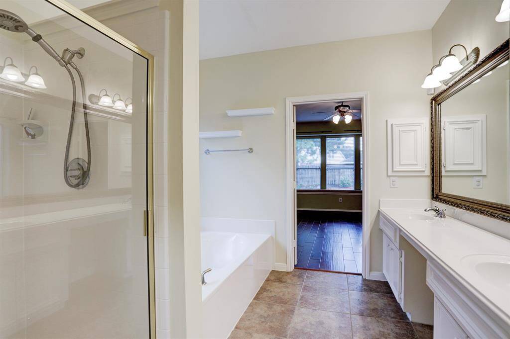 There is a tub and a separate shower in the primary bath.