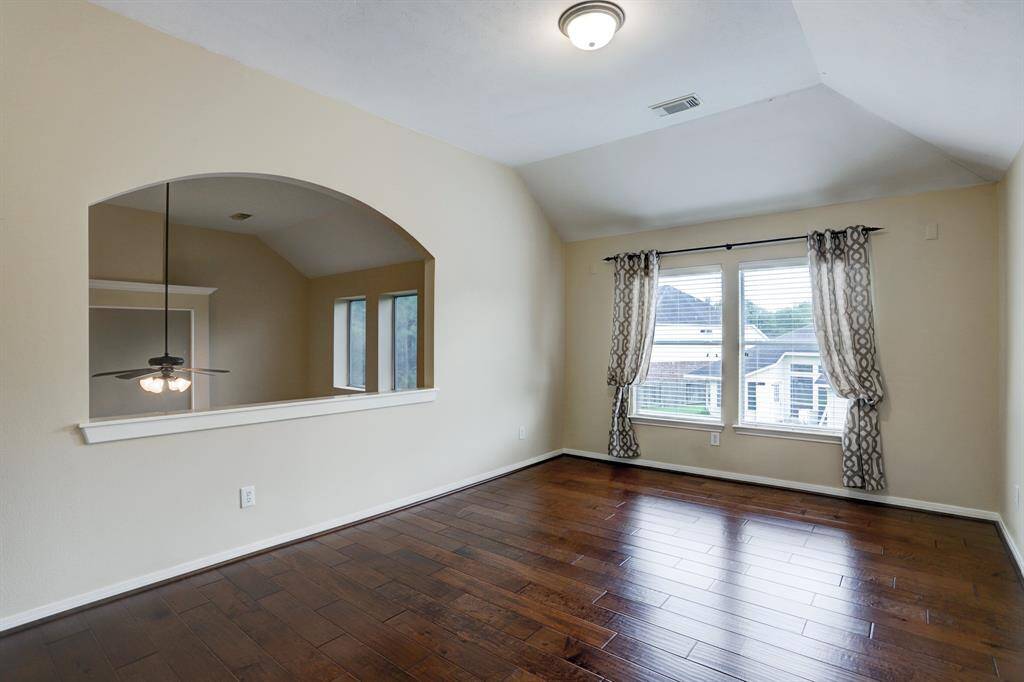 The gameroom is upstairs.  It overlooks the main living area and has engineered wood flooring.
