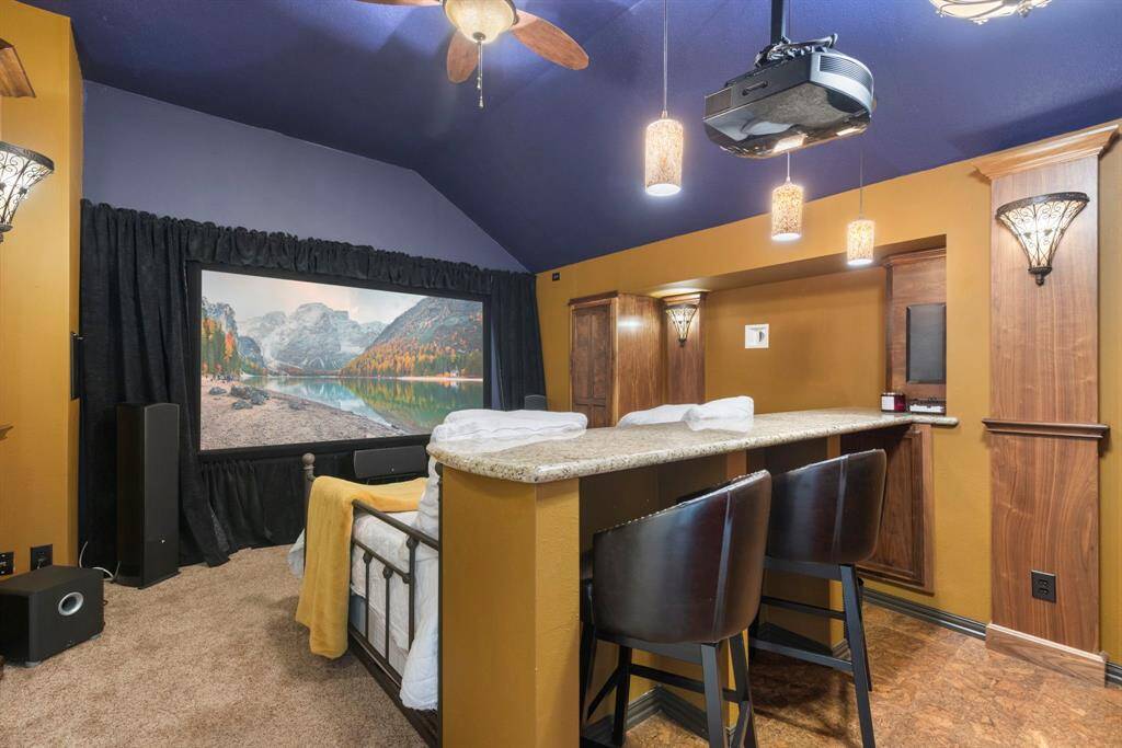 Media room upstairs with bar. All media equipment stays!