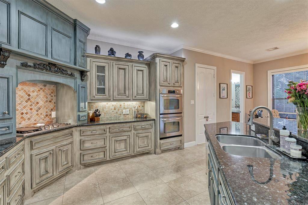 The door seen to the right houses a generous sized walk-in pantry that has counter space and is a convenient place for the microwave, coffee maker, and other larger appliances you wish to keep out of eyeshot!