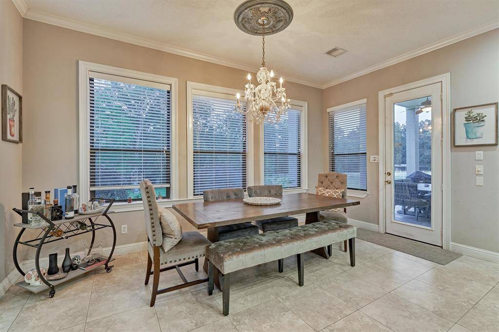 The dining area overlooks the lush back yard and creek beyond and has lots of natural light!