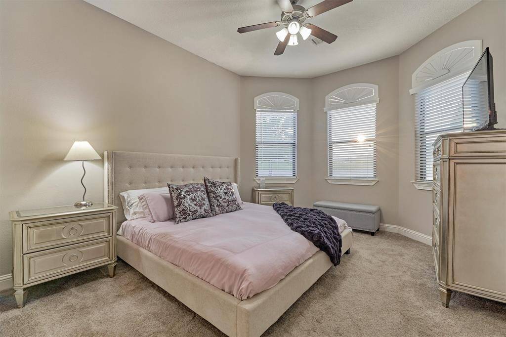 This guest room, also on the first floor, offers an en suite bath and walk in closet.