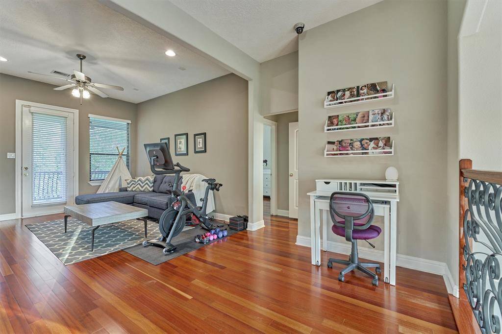 Family & friends will love congregating in this upstairs game room.