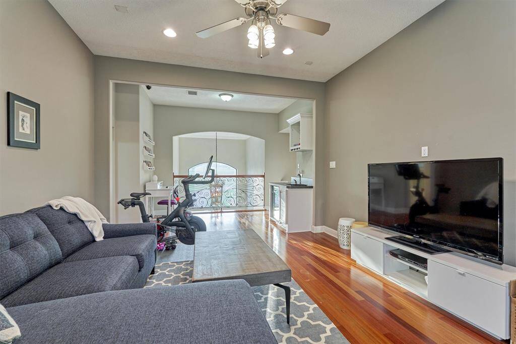 Homes with spaces designed to promote togetherness and fun are even more valued in today's current climate! Note the wet bar and balcony!
