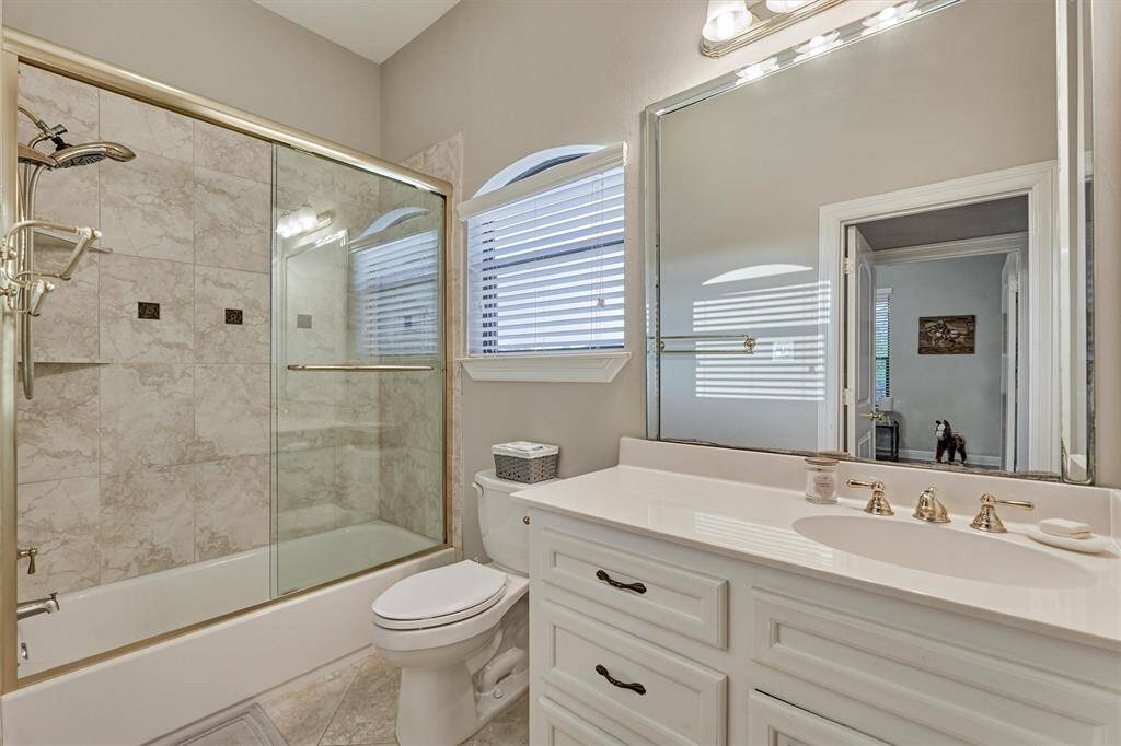 This upstairs bath serves the bedroom as well as game room.