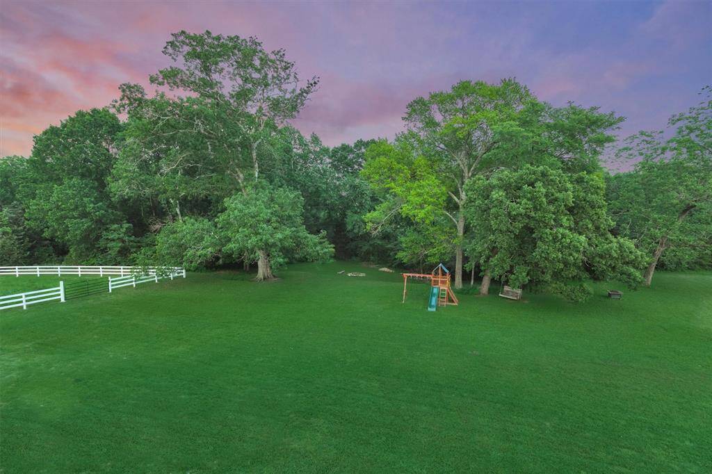 A view of the back yard from the upstairs balcony.