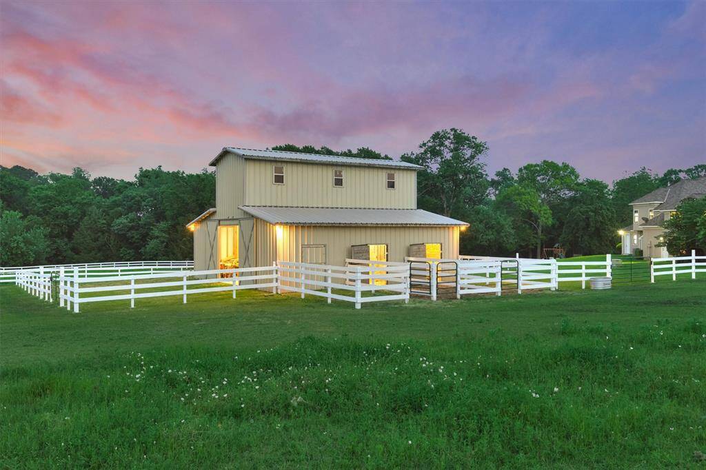 The barn is steps away from the home, keeping your horses close.