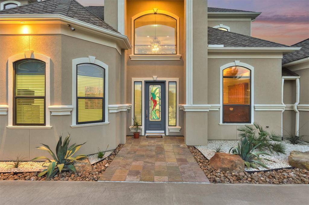 The exterior is very welcoming with its neatly manicured landscaping in rock beds.