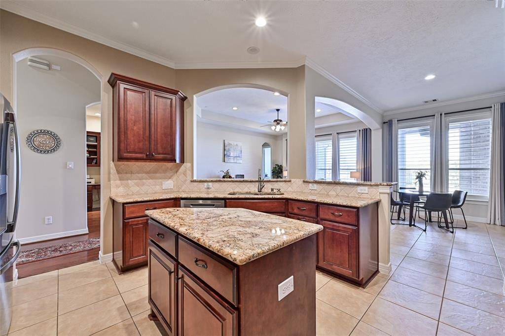 The island in the kitchen is a blessing as it provides not only counter space but also storage space