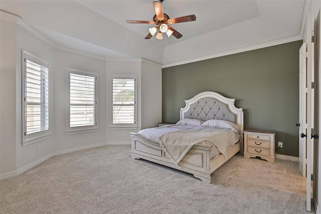 Primary suite with plenty of space. Imagine yourself sitting by this bay window with your favorite drink and a good book enjoying the beautiful backyard views
