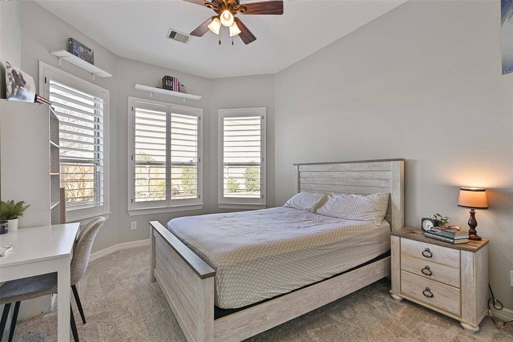 Bedroom 1. The bay window is so charming! It makes the room so nice and bright. Also has a ceiling fan