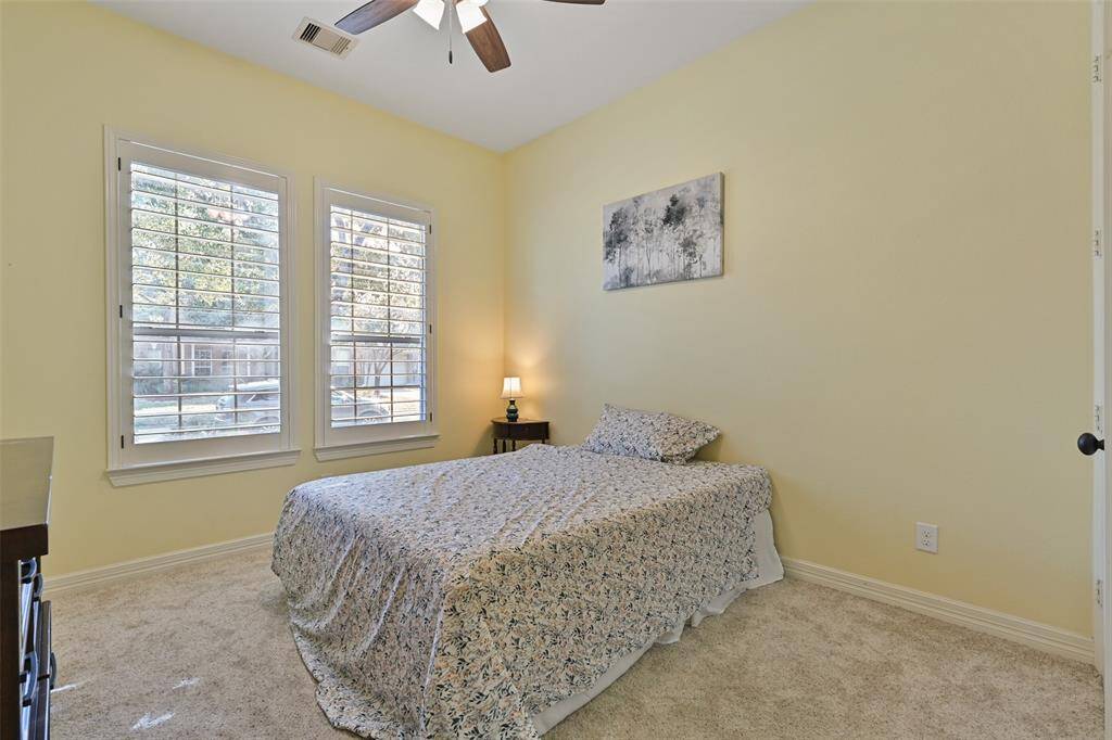 Bedroom #4 with elegant colors make it such a cozy place.  Since it is very strategically located (facing front of the home), it can be used as a guest bedroom offering privacy. Full bath next to it