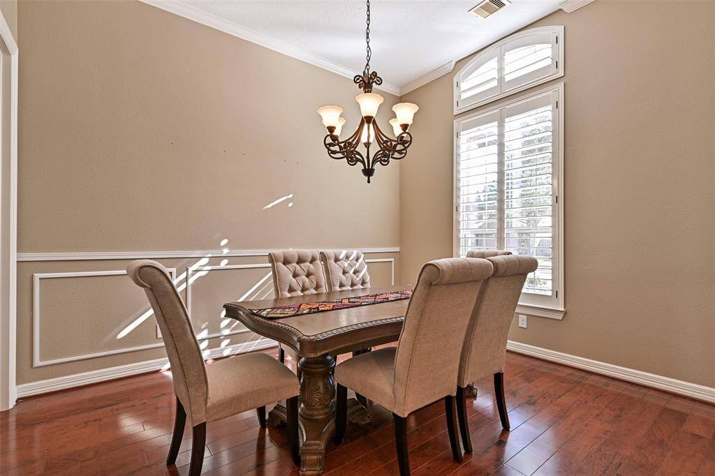 As you enter the home, the Formal Dining Room is to your right with a bright window facing the front