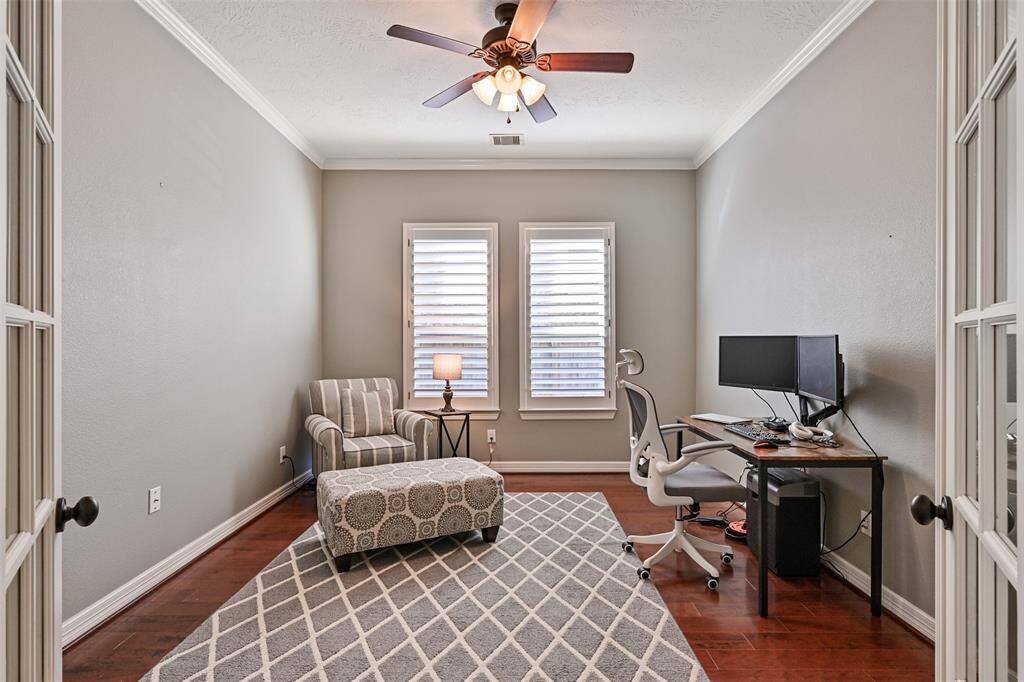 The Study or Home Office is nicely located by the entrance door and also has hardwood floors and french doors for privacy
