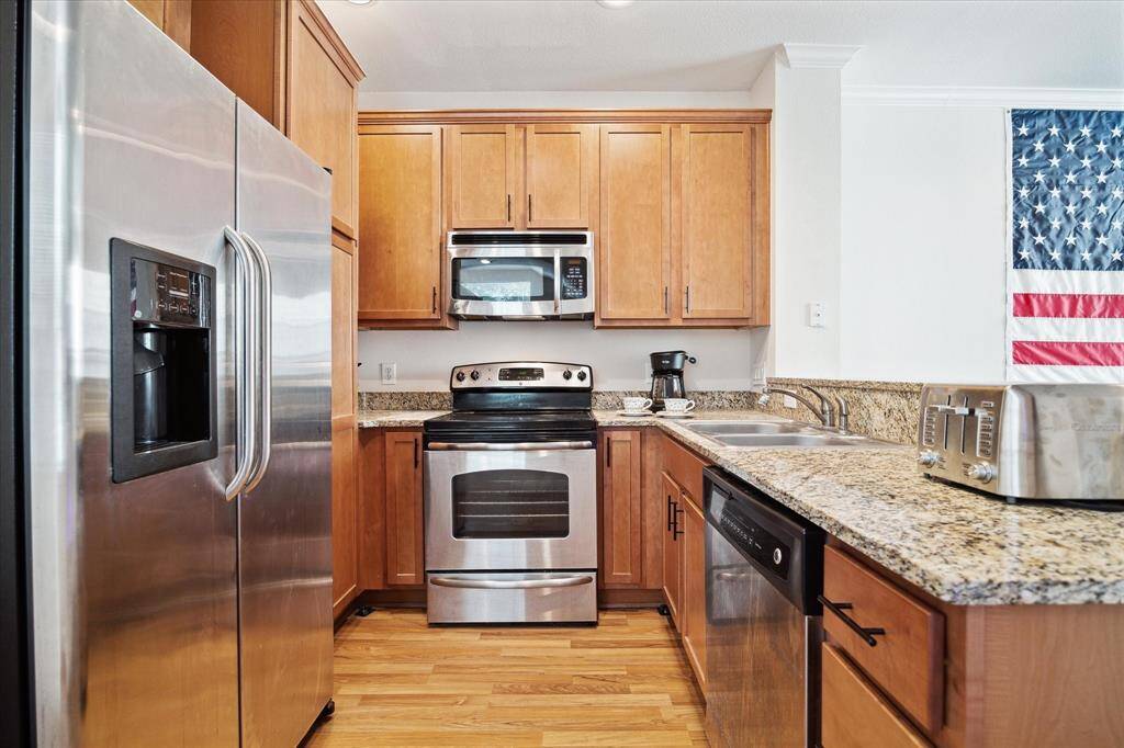 Kitchen showing the Stainless Steel Refrigerator which can stay with the Home.