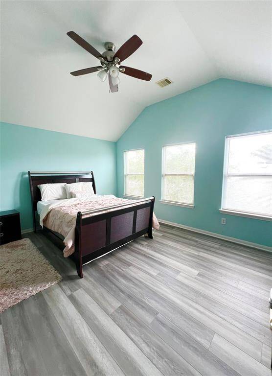 Large windows with Natural light in the primary bedroom.