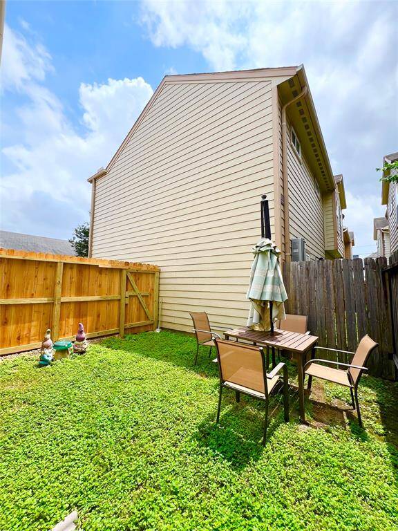 Spacious gated backyard.