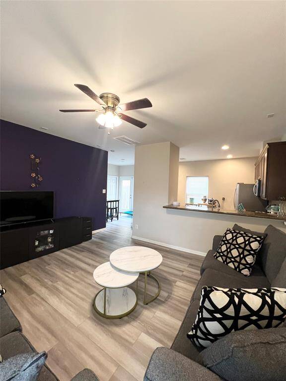 Living room opens into the kitchen.