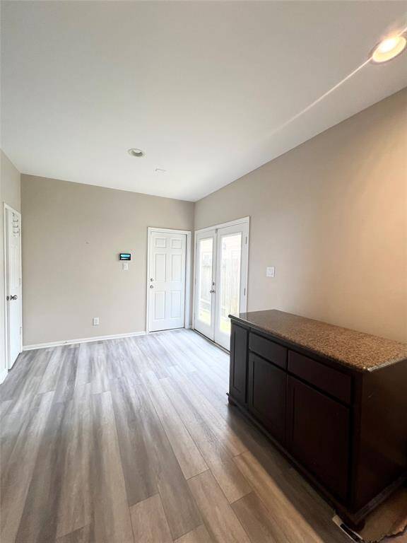 The kitchen opens up to the dining area.