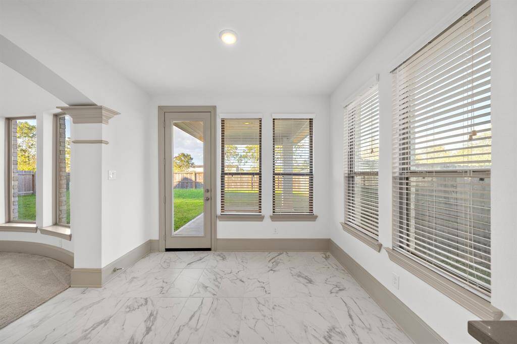 Find multiple storage options in the kitchen courtesy of the stylish cabinetry and entertain seamlessly with easy access to the adjoining dining room.