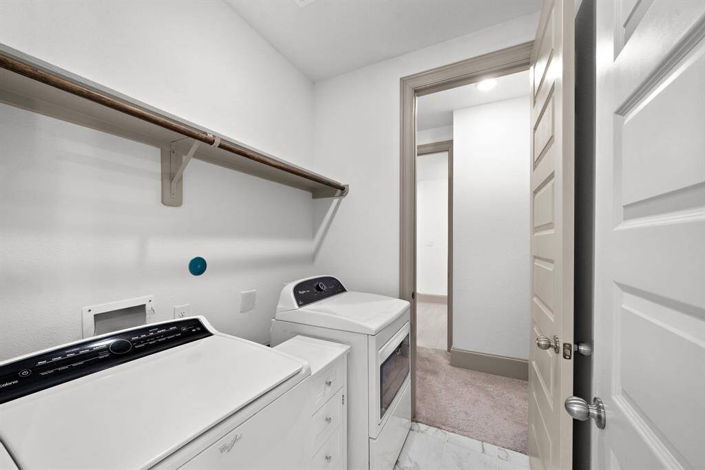 Dual vanities, paired with ample counter space and storage, ensure convenience and style for morning routines and evening unwinding.
