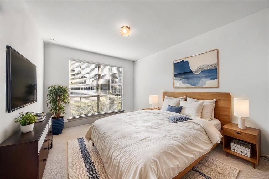 The laundry room offers a practical and efficient setup, featuring built-in shelving for organization and a designated space for your washer and dryer.