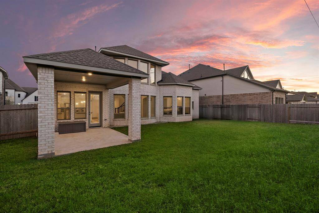 Transform your backyard into the ultimate outdoor retreat! This fully fenced oasis offers expansive green spaces, a covered patio, and endless possibilities for a refreshing pool or a summer kitchen.