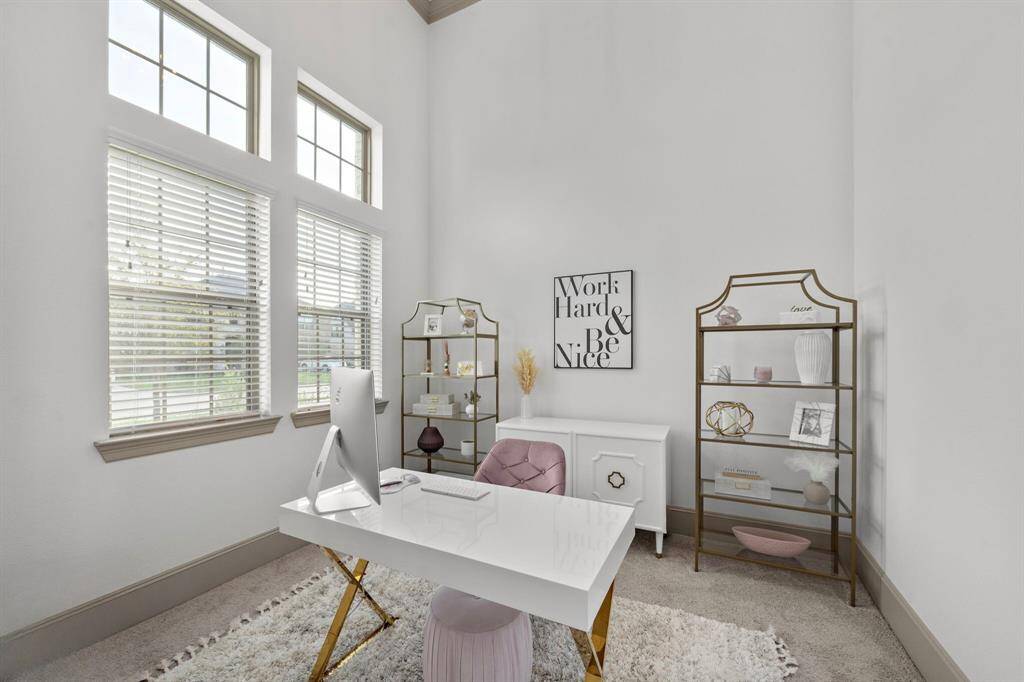 Greet guests in the foyer showcasing high ceilings, access to the study and formal dining room, plus gleaming tile floors that extend throughout the first-floor living areas.
