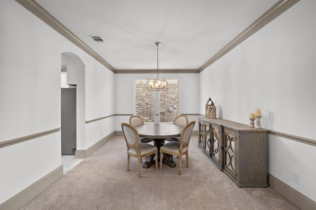 The dedicated study boasts high ceilings, oversized windows that invite natural light, and a thoughtfully designed layout, offering the perfect space for productivity or quiet reflection.