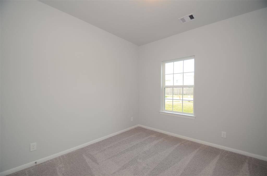 Study has carpet & blinds.