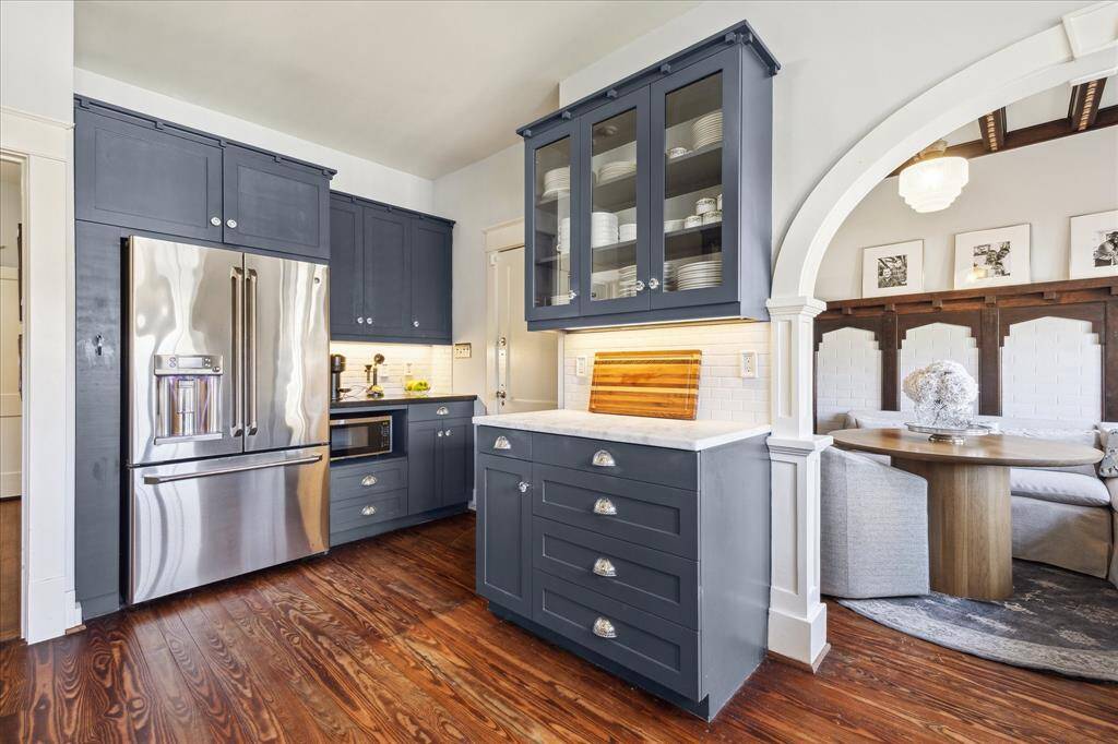 The kitchen functions wells with three prep stations. The coffee bar, refrigerator and one of the counter prep stations. There is a huge spice pullout to the left of the refrigerator.  We'll get tot the breakfast room soon.
