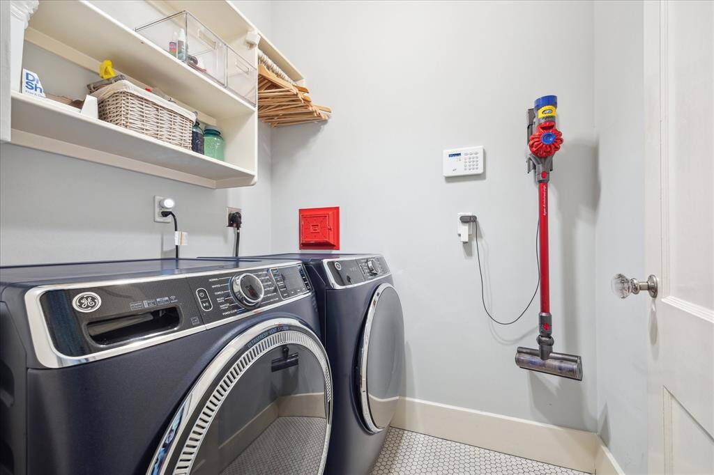 The laundry room is accessed through the central hall.